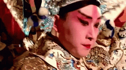 A Chinese opera character is surprised to have been roped into all this
