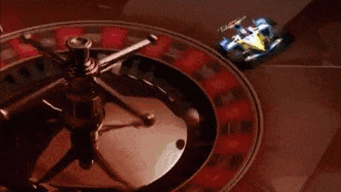 A Renault drives around a roulette wheel overseen by a giant David Coulthard wearing a tuxedo