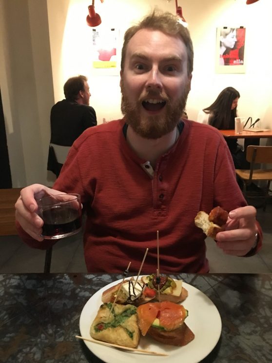 Me looking happy with pinxos and wine
