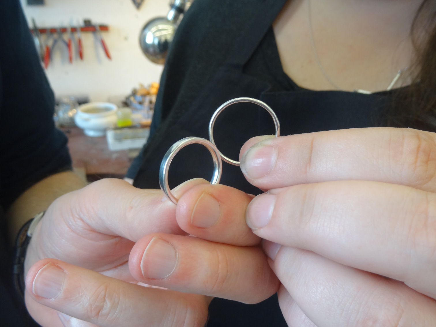 Close up of our rings being held by us