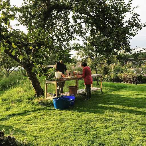 Sean and Madeline working on the apples