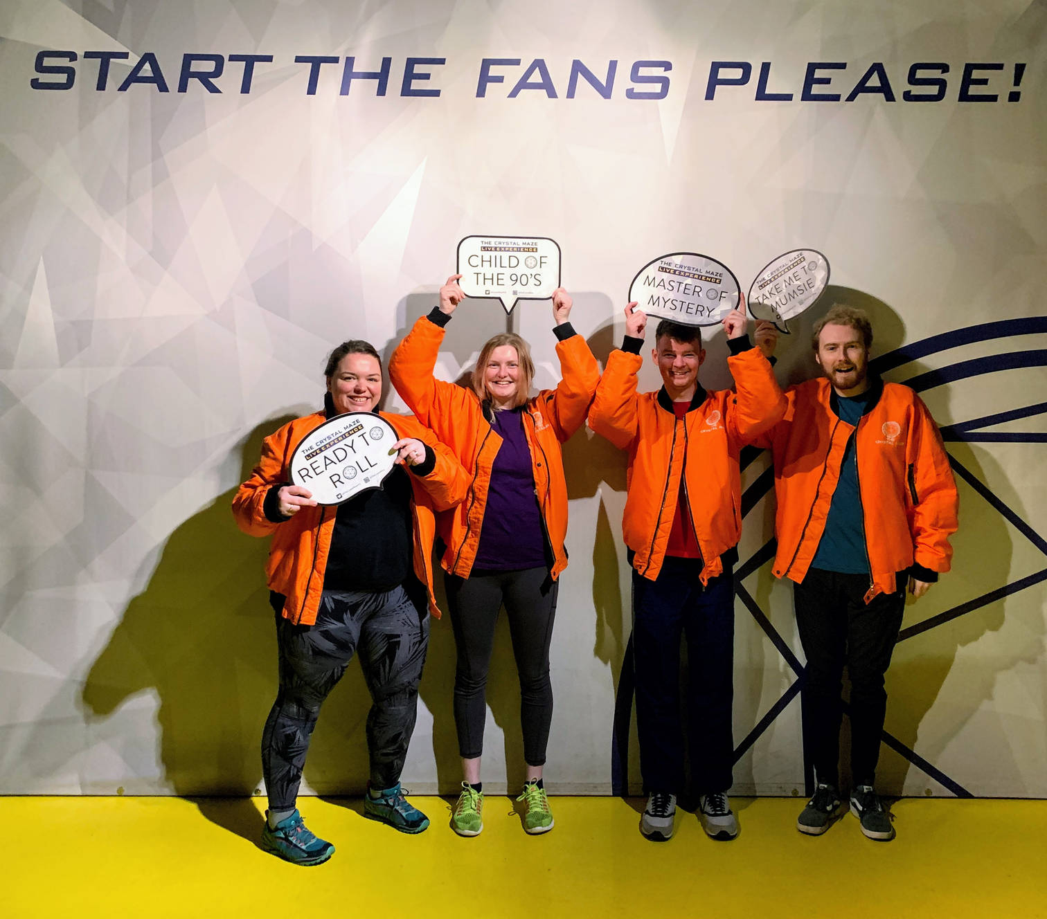 Alex, Lucy, Richard and me posing with signs under the slogan "Start the fans please!"