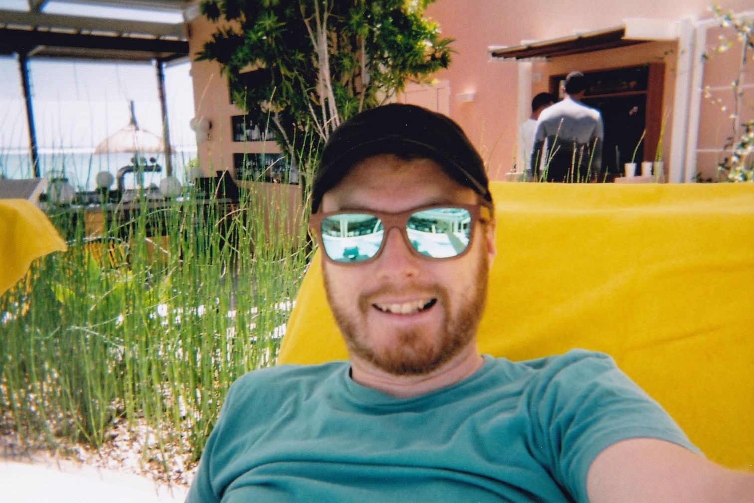 A selfie of me wearing my new sunglasses (taken on the disposable camera)