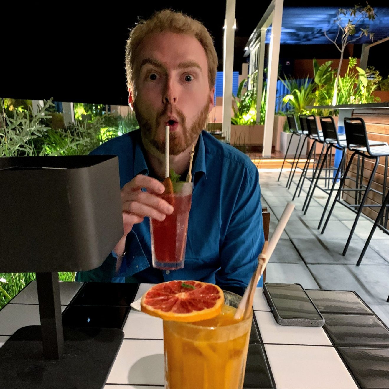 Me sipping a cocktail