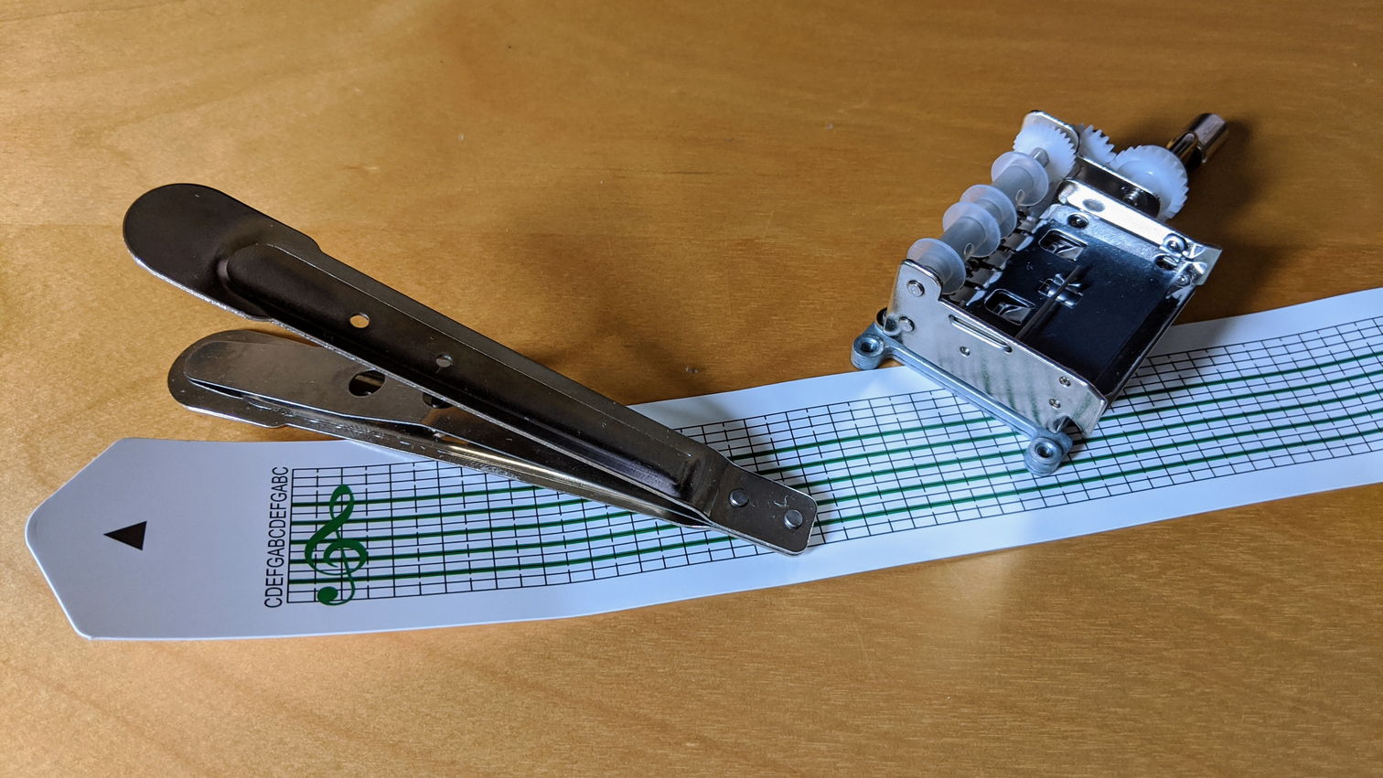 Mini music box with hole punch and card