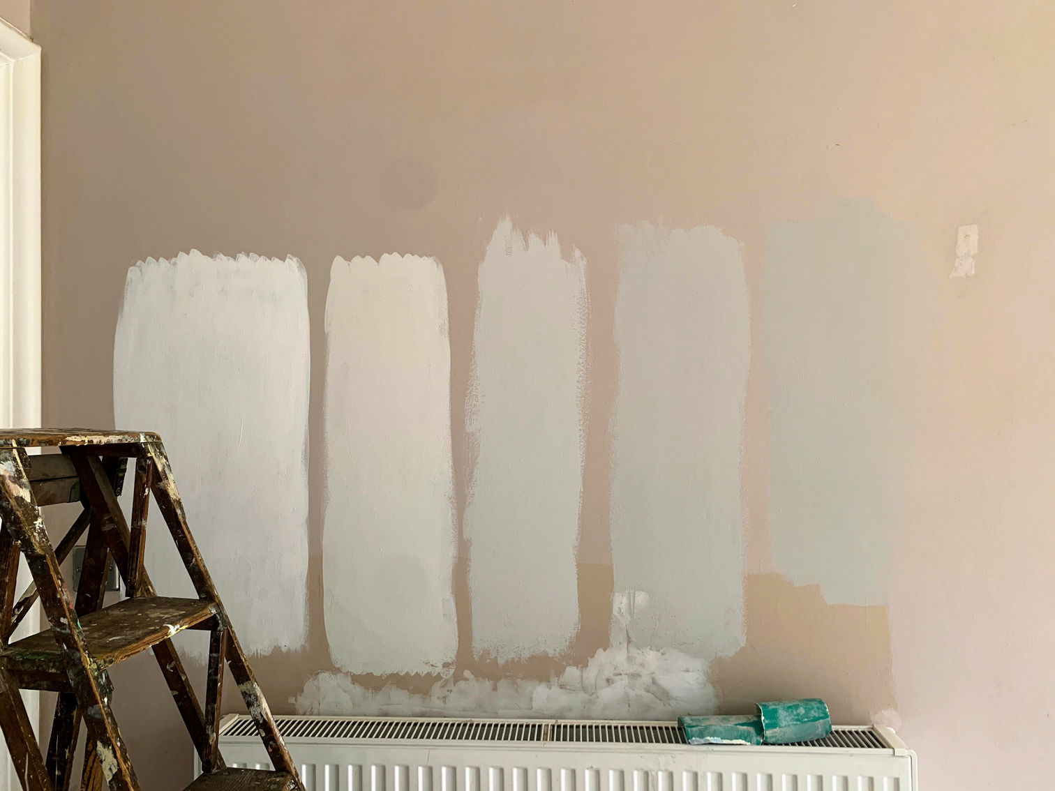 Test patches of various shades of grey paint
