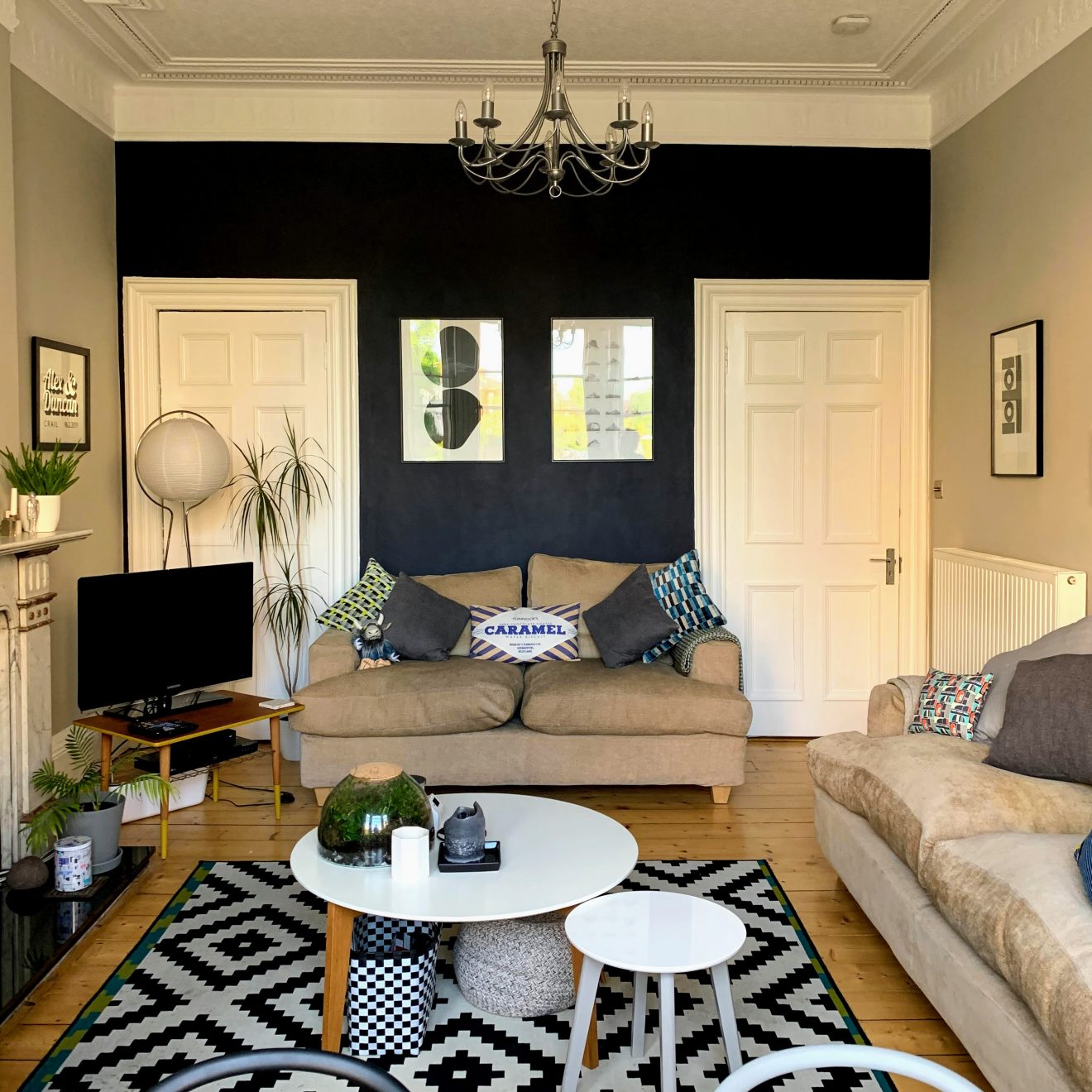 The newly redecorated living room with its dark blue wall