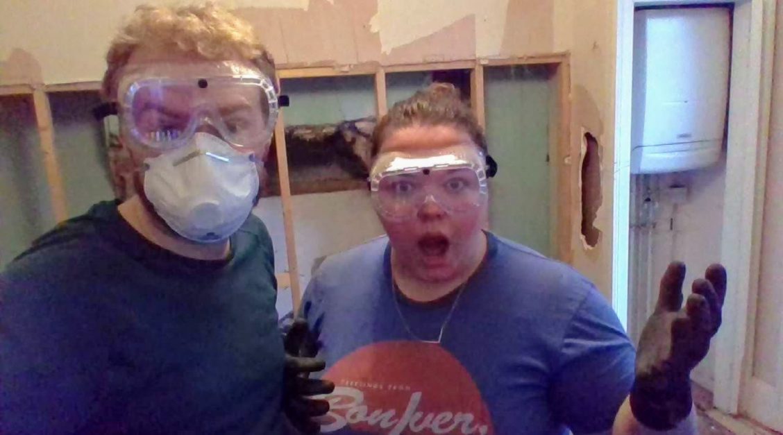 Me and Alex wearing masks while demolishing a false wall