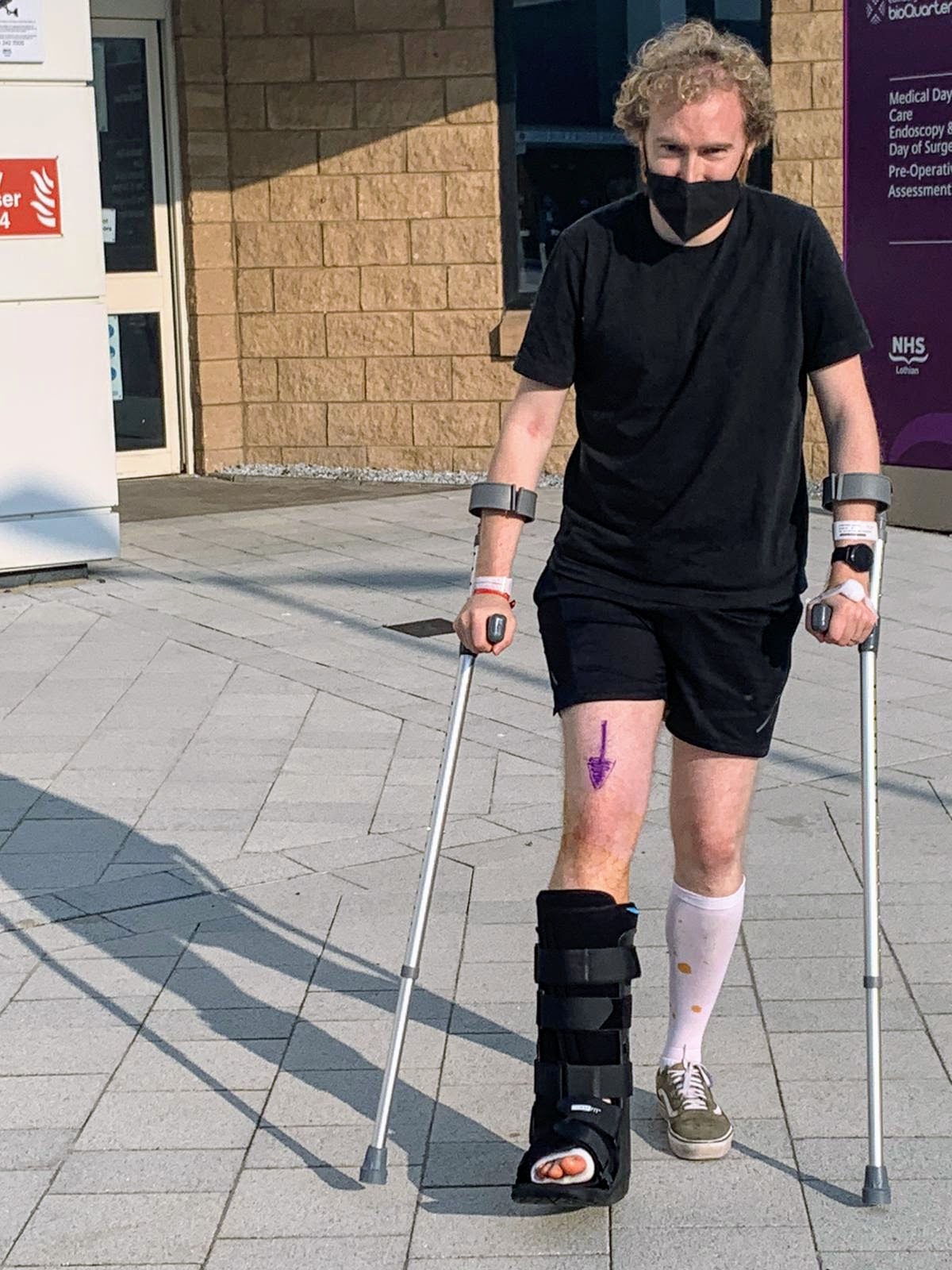 Me on crutches, emerging from hospital following my first surgery