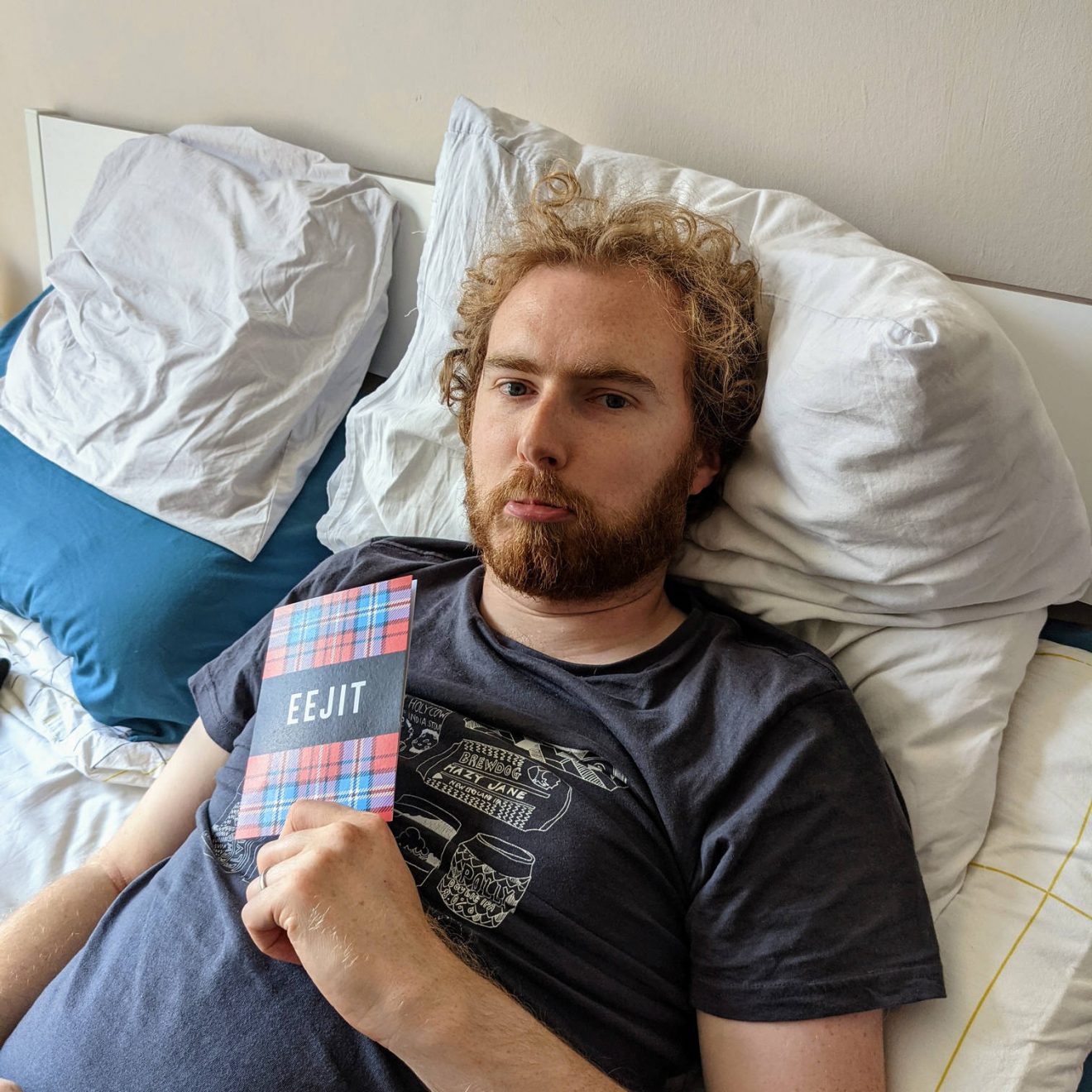 Me looking sad holding a card that says: "Eejit"